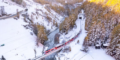 Couple enjoying glass onboard Glacier Express